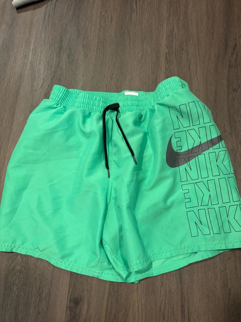 Nike Mint Green Athletic Shorts with Black Swoosh and Drawstring